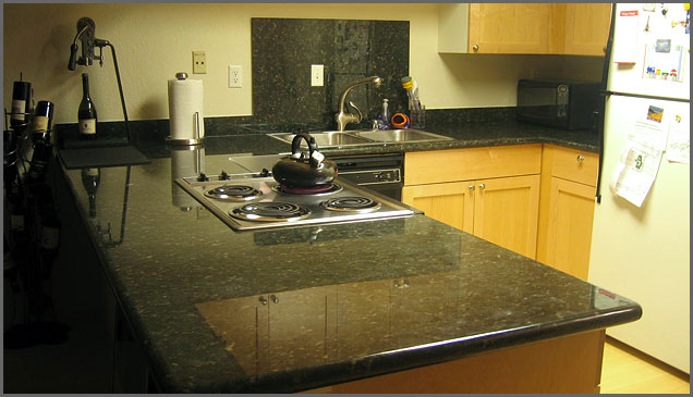verde countertop with cabinets
